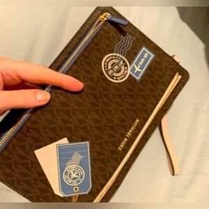 Brand new, limited edition,rare/collective authentic Michael Kors travel pouch.